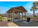 Neighborhood pavilion featuring a picnic table and grilling area, perfect for outdoor gatherings at 2837 Darlington Oak Ln, Ocoee, FL 34761