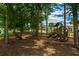 Community playground with wooden play structure and a slide at 2837 Darlington Oak Ln, Ocoee, FL 34761