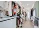 Walk-in closet with custom shelving and ample storage space at 2837 Darlington Oak Ln, Ocoee, FL 34761