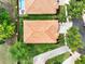 Aerial view showing a home with tile roofing that is complemented by mature trees and paved driveway at 2843 Maria Isabel Ave, Ocoee, FL 34761