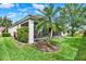 Charming home exterior with a well-manicured lawn, vibrant greenery, and a delightful screened-in lanai at 2843 Maria Isabel Ave, Ocoee, FL 34761