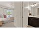 View from bedroom to bathroom with modern fixtures and finishes, offering convenience and style at 2843 Maria Isabel Ave, Ocoee, FL 34761