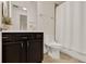 A traditional bathroom featuring a vanity, toilet, shower and decorative accents at 2843 Maria Isabel Ave, Ocoee, FL 34761