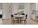 Cozy breakfast nook by a large window with white curtains, perfect for enjoying morning coffee at 2843 Maria Isabel Ave, Ocoee, FL 34761