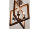 Wooden boxy chandelier with visible light bulbs provides soft illumination at 2843 Maria Isabel Ave, Ocoee, FL 34761