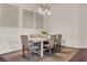 Elegant dining room featuring neutral tones, seating for six, and a stylish chandelier at 2843 Maria Isabel Ave, Ocoee, FL 34761