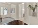 Welcoming foyer area with a decorative rug, stylish bench, and an entry to the home's living spaces at 2843 Maria Isabel Ave, Ocoee, FL 34761