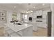 Beautiful kitchen featuring two islands, stainless steel appliances, and white cabinetry at 2843 Maria Isabel Ave, Ocoee, FL 34761