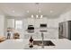 Modern kitchen featuring stainless steel appliances, an island with seating and plenty of cabinets at 2843 Maria Isabel Ave, Ocoee, FL 34761
