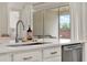 Kitchen island features stainless steel dishwasher and sink at 2843 Maria Isabel Ave, Ocoee, FL 34761