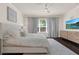 Bright and airy main bedroom with a modern ceiling fan, TV, and stylish furnishings for ultimate comfort at 2843 Maria Isabel Ave, Ocoee, FL 34761