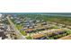 Aerial view of a coastal community with townhomes, landscaping and waterway at 33 Sea Haven Dr, Ponce Inlet, FL 32127