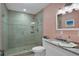 Elegant bathroom featuring a modern glass-enclosed shower, light walls, and a granite vanity at 33 Sea Haven Dr, Ponce Inlet, FL 32127