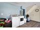 Bright laundry area with a washer, dryer, painted walls, and ample space at 33 Sea Haven Dr, Ponce Inlet, FL 32127