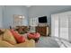 Open living area featuring a dining table, tile floors, and large sliding glass doors at 33 Sea Haven Dr, Ponce Inlet, FL 32127