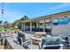 A covered community outdoor dining and picnic area with ceiling fans and plenty of seating at 33 Sea Haven Dr, Ponce Inlet, FL 32127