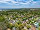 Scenic aerial view of the community, featuring tree-lined streets, and waterfront at 33215 Kaylee Way, Leesburg, FL 34788