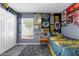 Cozy bedroom featuring a grey color scheme and plenty of Green Bay Packers memorabilia at 33215 Kaylee Way, Leesburg, FL 34788