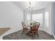 Charming dining area with natural lighting, cozy seating, and views of the surrounding greenery at 33215 Kaylee Way, Leesburg, FL 34788