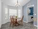 Bright breakfast nook with a charming table set and natural light, adjacent to the laundry area at 33215 Kaylee Way, Leesburg, FL 34788