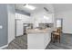 Bright kitchen featuring granite countertops, modern appliances, and an open layout, perfect for entertaining at 33215 Kaylee Way, Leesburg, FL 34788