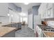 Well-appointed kitchen with granite countertops, stainless steel appliances, and eat-in dining area at 33215 Kaylee Way, Leesburg, FL 34788