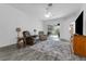 Spacious living room area with modern furniture and a sliding glass door to the pool deck at 33215 Kaylee Way, Leesburg, FL 34788