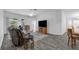 Inviting living room featuring neutral colors, comfortable seating, vinyl flooring, and lots of natural light at 33215 Kaylee Way, Leesburg, FL 34788