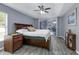 Comfortable main bedroom with sliding glass doors, offering a relaxing retreat at 33215 Kaylee Way, Leesburg, FL 34788