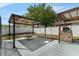 This outdoor kitchen features a built-in BBQ and a shaded pergola with comfortable seating at 33215 Kaylee Way, Leesburg, FL 34788
