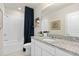Modern bathroom with white subway tile, a sleek vanity with granite countertop, and a soaking tub at 3611 Cambridge Brook Dr, Davenport, FL 33837