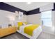 Vibrant bedroom featuring a color block wall design and a sunny window view at 3611 Cambridge Brook Dr, Davenport, FL 33837