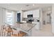 Bright kitchen featuring stainless steel appliances, a kitchen island with seating, and tiled backsplash at 3611 Cambridge Brook Dr, Davenport, FL 33837