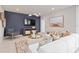 Comfortable living room features stylish decor, a large TV, and modern lighting fixtures at 3611 Cambridge Brook Dr, Davenport, FL 33837