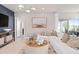 Bright living room featuring stylish furniture, a modern coffee table, and an open floor plan at 3611 Cambridge Brook Dr, Davenport, FL 33837