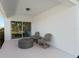 Inviting covered patio with comfortable seating, perfect for relaxing outdoors and enjoying the view at 3611 Cambridge Brook Dr, Davenport, FL 33837