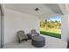 Stylish covered patio with outdoor furniture, offering a peaceful spot to unwind and enjoy the landscaped backyard at 3611 Cambridge Brook Dr, Davenport, FL 33837