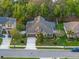 Beautiful home with solar panels, mature trees, and manicured front lawn at 3637 Chandler Estates Dr, Apopka, FL 32712
