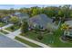 Aerial view of the home with lush landscaping and well-manicured lawn at 3637 Chandler Estates Dr, Apopka, FL 32712
