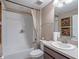 Clean bathroom showcasing a tub with shower and a single vanity sink at 3637 Chandler Estates Dr, Apopka, FL 32712