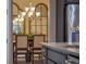 Beautiful dining room with elegant chandelier, decorative mirrors, and neutral color palette at 3637 Chandler Estates Dr, Apopka, FL 32712