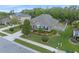 Charming home with manicured lawn, blue shutters, and stone accents for added curb appeal at 3637 Chandler Estates Dr, Apopka, FL 32712