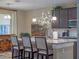 The kitchen includes a spacious island with seating, pendant lighting, and modern countertops at 3637 Chandler Estates Dr, Apopka, FL 32712