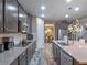 Gourmet kitchen with stainless appliances, granite countertops, and wood-look tile flooring at 3637 Chandler Estates Dr, Apopka, FL 32712