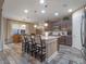 Modern kitchen featuring a central island with seating and modern stainless appliances at 3637 Chandler Estates Dr, Apopka, FL 32712