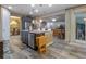 Open concept kitchen with an island, stainless steel appliances and an adjacent dining area at 3637 Chandler Estates Dr, Apopka, FL 32712
