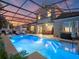 Inviting screened-in pool area with modern outdoor furniture, creating an ideal setting for relaxation and entertainment at 3637 Chandler Estates Dr, Apopka, FL 32712
