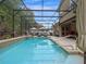 Relaxing screened pool with outdoor lounge furniture and tiled accents at 3637 Chandler Estates Dr, Apopka, FL 32712