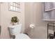 Clean bathroom view featuring toilet, floral accent, and simple decor at 3664 Wilshire Way Rd # 261, Orlando, FL 32829