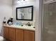Well-lit bathroom featuring a vanity with ample storage and a separate shower enclosure at 3664 Wilshire Way Rd # 261, Orlando, FL 32829